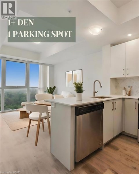A modern kitchen with a dishwasher, sink, and a window overlooking the outdoors.