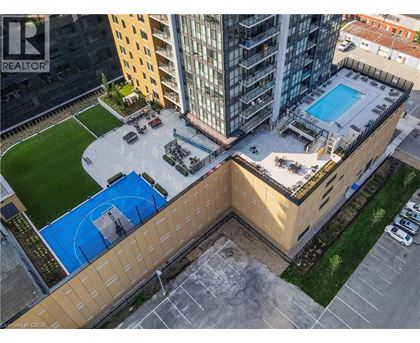 A swimming pool is located on the roof of a building.
