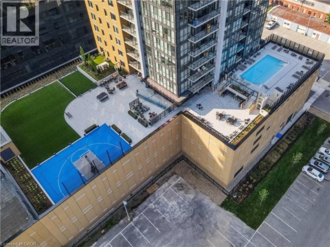 A swimming pool is located on the roof of a building.