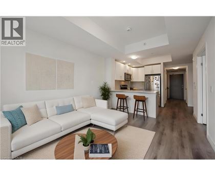 A modern living room with a white sofa and a wooden coffee table.