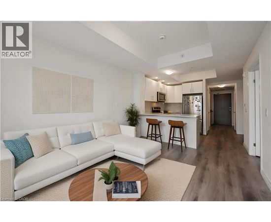 A modern living room with a white sofa and a wooden coffee table.