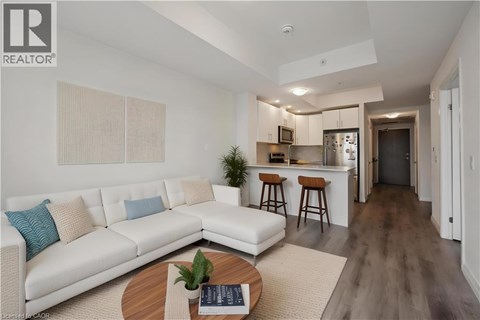 A modern living room with a white sofa and a wooden coffee table.
