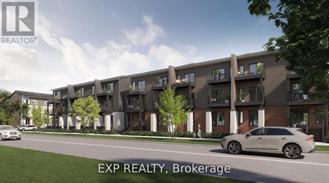 A modern apartment complex with a car parked in front.
