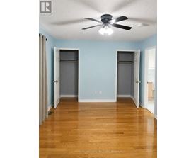 A room with two doors and a wall socket.