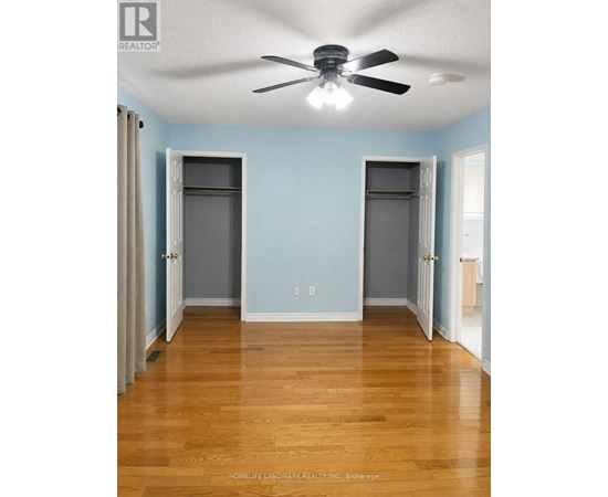 A room with two doors and a wall socket.