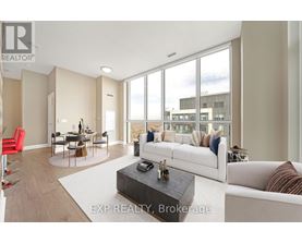 A living room with a white couch and a coffee table.