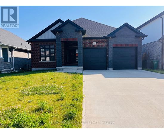 A house with a grey roof and a garage door is for sale.