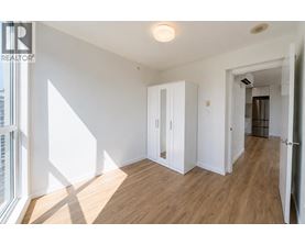 A room with a wooden floor and white walls.