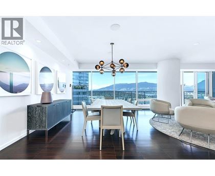 A modern dining room with a view of the city.