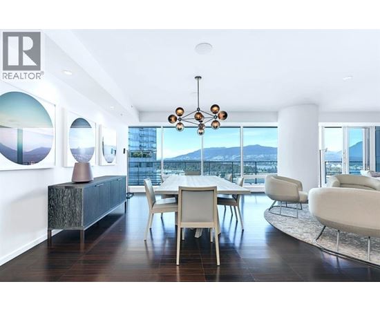 A modern dining room with a view of the city.