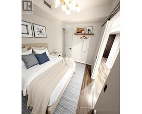 A bedroom with a bed, pillows, a blanket, a coat hanger, and a mirror.