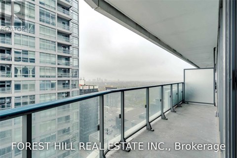 A balcony of a building with the words "FOREST HILL REAL ESTATE INC., Brokerage" written on it.