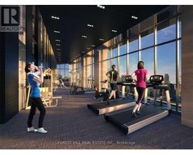 A gym with people exercising and a sign that says REALTOR.