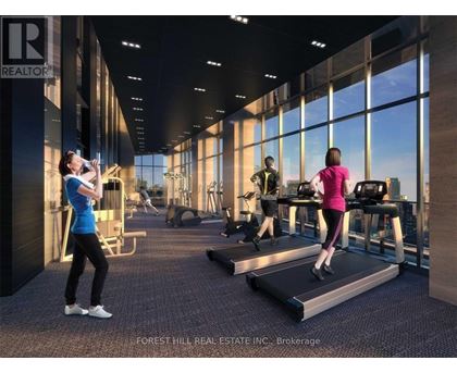 A gym with people exercising and a sign that says REALTOR.