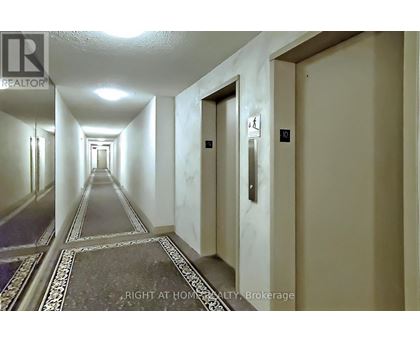 A long hallway with doors on both sides.