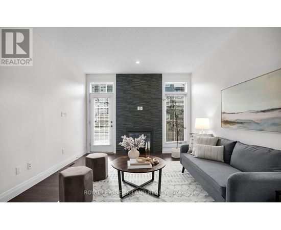 A modern living room with a grey couch and a coffee table.
