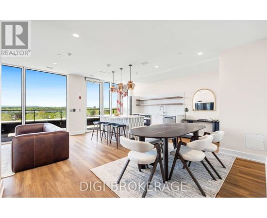 A modern dining room with a large table and chairs.