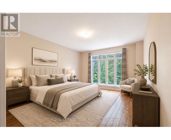 A well-lit bedroom with a large bed and a view of greenery outside the window.