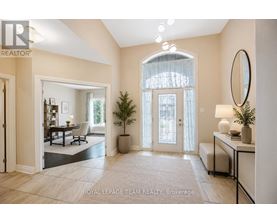 A well-lit, spacious room with a dining area and a large window.