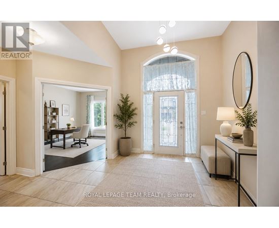 A well-lit, spacious room with a dining area and a large window.