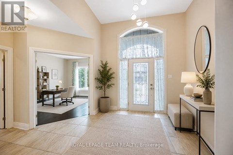 A well-lit, spacious room with a dining area and a large window.