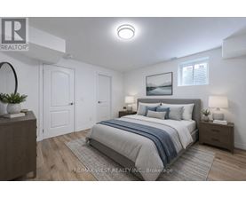 A bedroom with a bed, nightstands, and a painting on the wall.