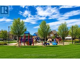 A playground with a slide and swings in a park.