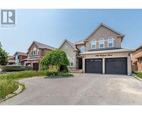 A large house with a driveway in front of it.
