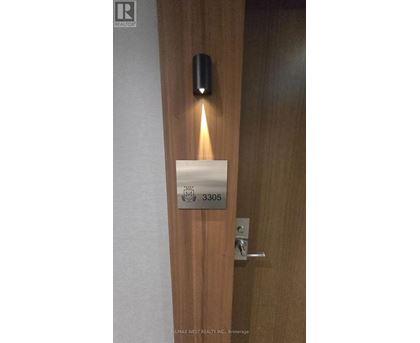 A door with a sign that says 3305 on it.
