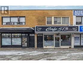 A building with a cafe and a sign for new patients.