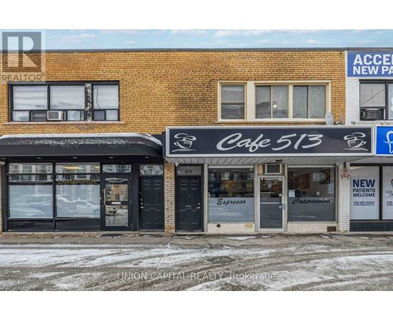 A building with a cafe and a sign for new patients.