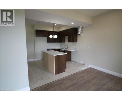 A kitchen with a wooden island in the middle of the room.