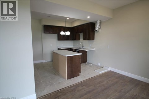 A kitchen with a wooden island in the middle of the room.