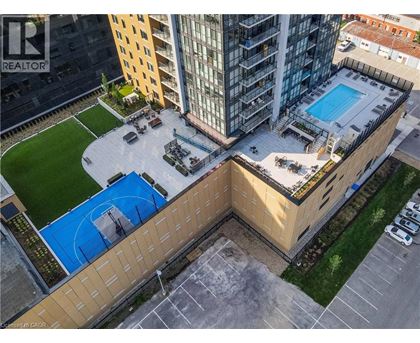 A swimming pool is located on the roof of a building.