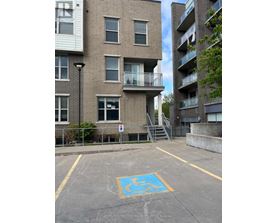 A parking space with a wheelchair symbol painted on the ground.