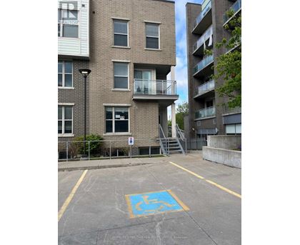 A parking space with a wheelchair symbol painted on the ground.