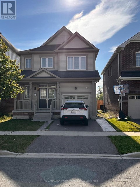 A house with a car parked in front of it.