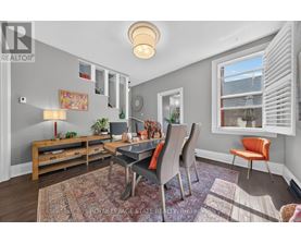 A well-lit dining room with a table set for four.