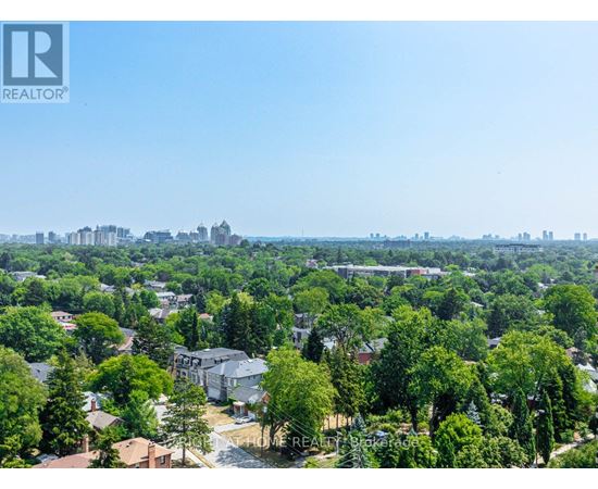 A bird's eye view of a residential area with houses and trees.