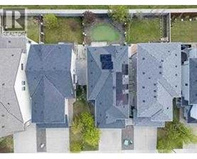 A bird's eye view of a residential area with multiple houses.