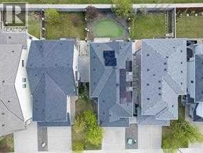 A bird's eye view of a residential area with multiple houses.