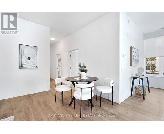A dining room with a table set for four.