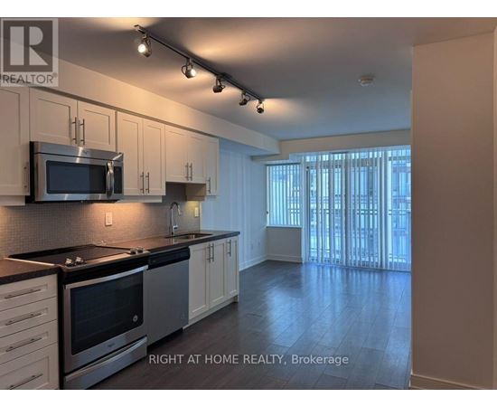 A kitchen with a stove top oven and microwave.