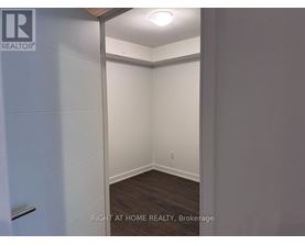 A brokerage image of an empty room with a white door.