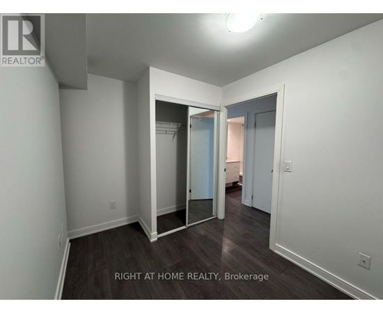 A room with a doorway leading to another room.