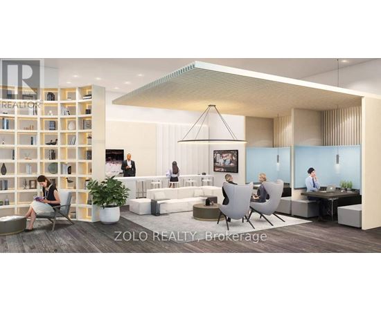 A modern office space with people working and a woman sitting on a chair.