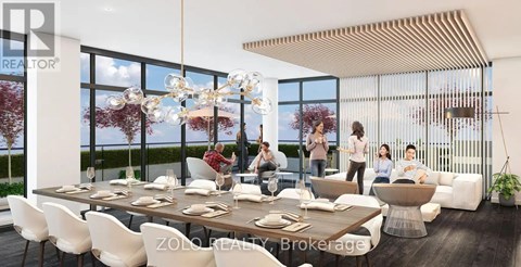 A modern dining room with a large table and chairs, a chandelier, and a view of the outdoors through large windows.