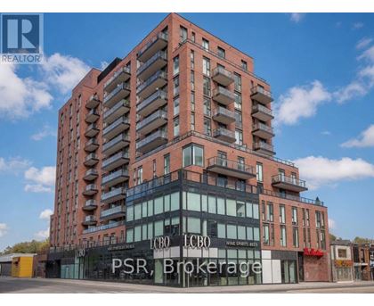 A tall building with a sign that reads "PSR Brokerage" in front of it.