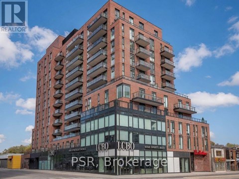 A tall building with a sign that reads "PSR Brokerage" in front of it.