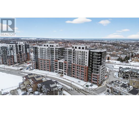 A real estate company logo is displayed on a snowy landscape with apartment buildings.